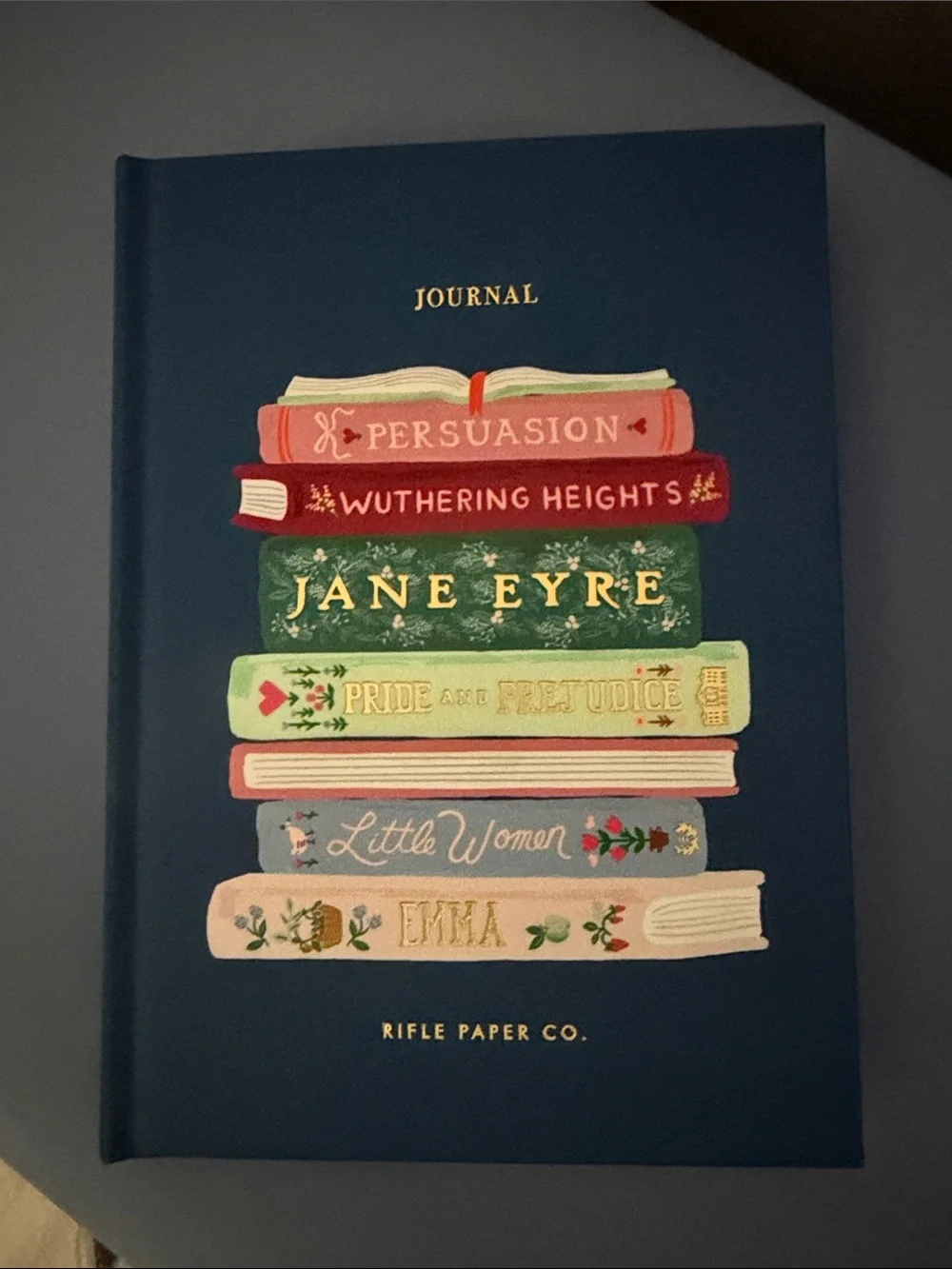 Rifle Paper Co. Navy Hardcover Journal with Colorful Stacked Book Illustration